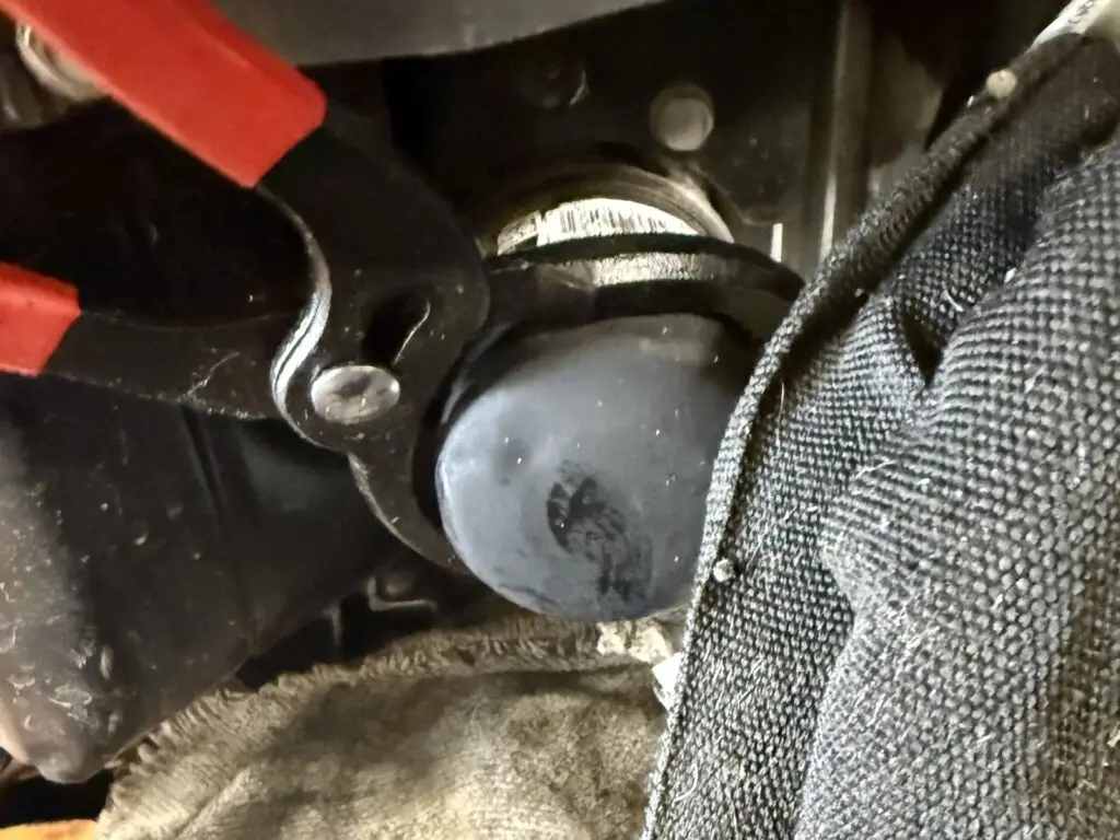 SCAG mower oil filter being changed during a PGM VELOCITY 1 Pit Stop service