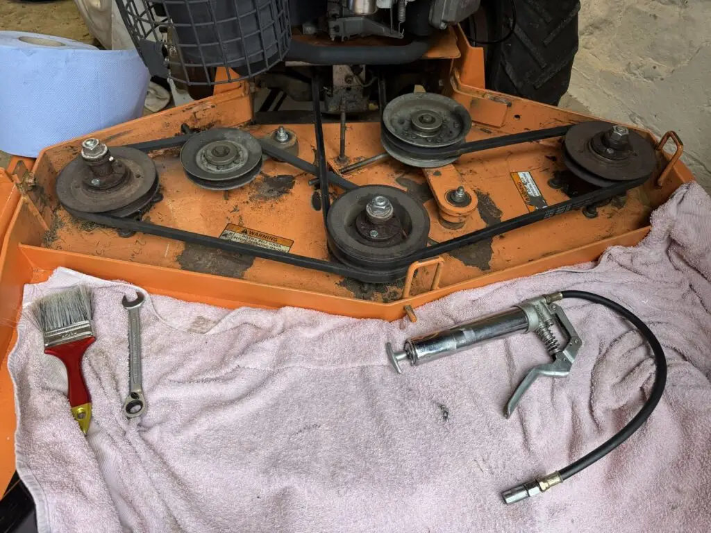 SCAG mower deck with belts and pulleys exposed during a PGM VELOCITY 2 Daily Grind service